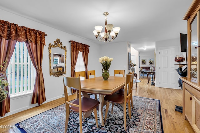 16 W Ave, Gladstone, NJ 07934 - dining space with a chandelier and light wood-style flooring