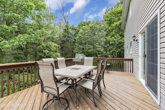 16 W Ave, Gladstone, NJ 07934 - deck with outdoor dining space, area for grilling, and view of scattered trees