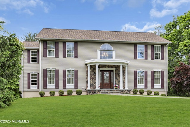 16 W Ave, Gladstone, NJ 07934 - colonial house featuring a front lawn and a shingled roof