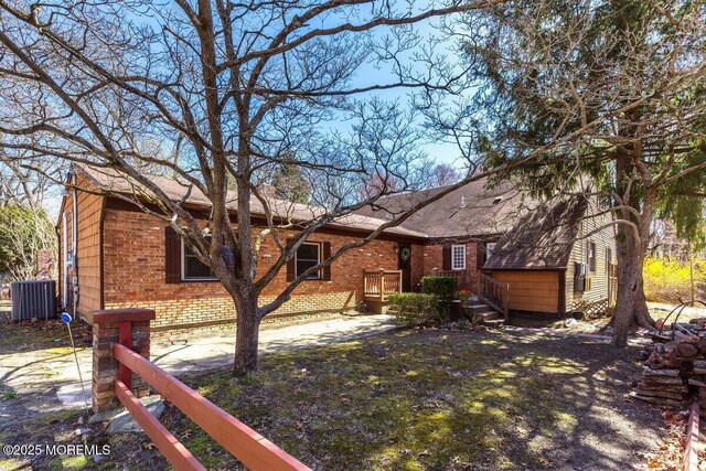 75 Brown Rd, Howell, NJ 07731 - view of front facade with brick siding and central air condition unit