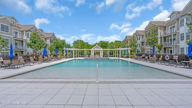 7 Centre St Unit 1303, Ocean Twp, NJ 07712 - view of pool with a residential view, a pool with connected hot tub, and a patio area