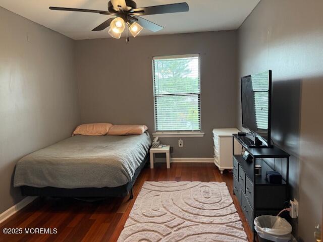 372 Oak Knoll Dr, Manalapan, NJ 07726 - bedroom with wood finished floors, baseboards, and ceiling fan