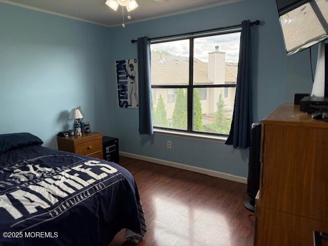 372 Oak Knoll Dr, Manalapan, NJ 07726 - bedroom featuring wood finished floors, baseboards, and ornamental molding