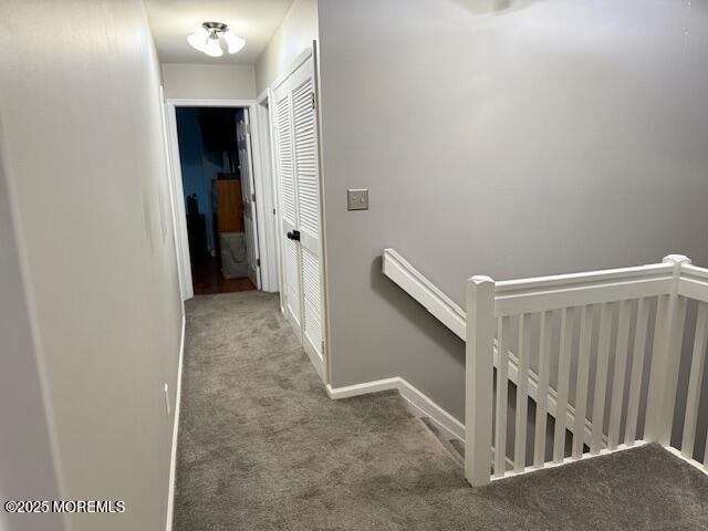 372 Oak Knoll Dr, Manalapan, NJ 07726 - hallway with an upstairs landing, carpet, and baseboards