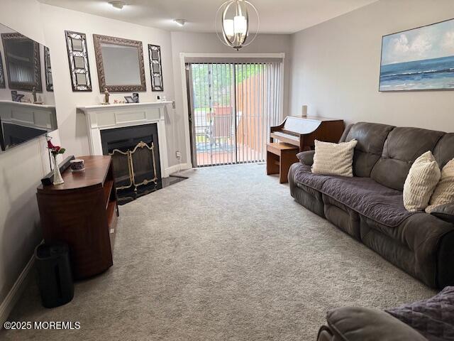 372 Oak Knoll Dr, Manalapan, NJ 07726 - carpeted living room with a fireplace with flush hearth, baseboards, and a chandelier