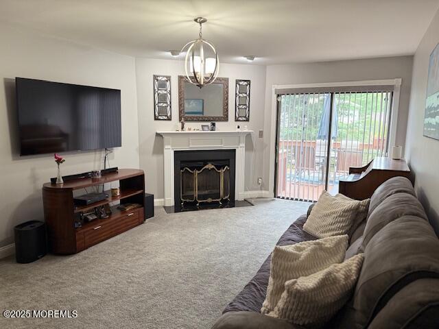 372 Oak Knoll Dr, Manalapan, NJ 07726 - living area with carpet flooring, a chandelier, a fireplace with flush hearth, and baseboards
