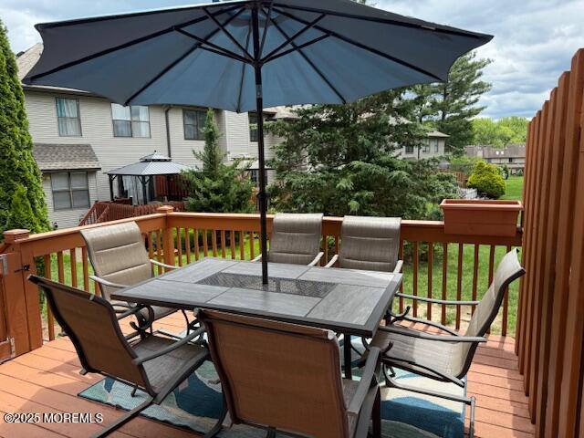372 Oak Knoll Dr, Manalapan, NJ 07726 - wooden terrace with outdoor dining area