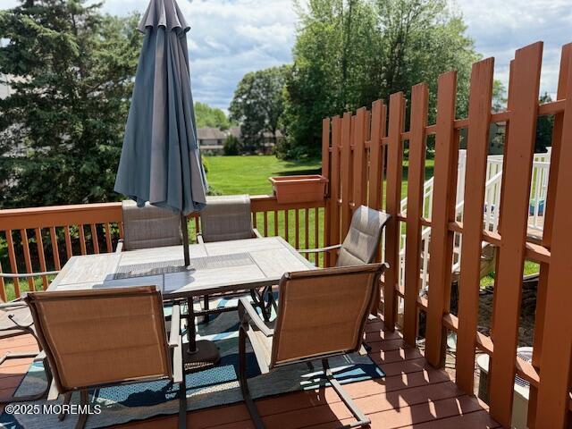 372 Oak Knoll Dr, Manalapan, NJ 07726 - wooden deck featuring outdoor dining area