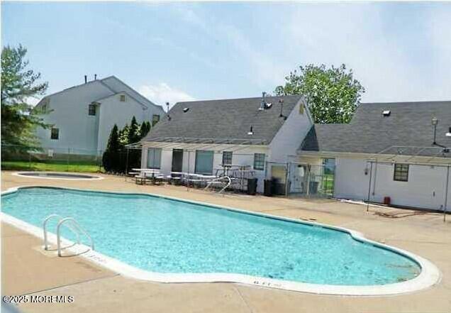 372 Oak Knoll Dr, Manalapan, NJ 07726 - community pool featuring a patio