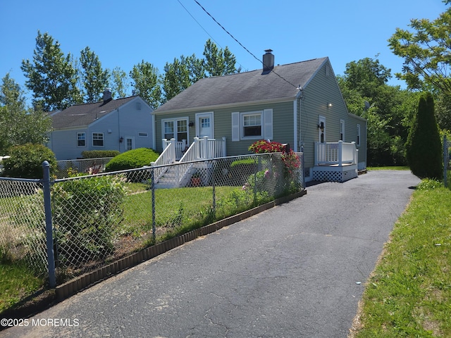 388 Atlantic Ave, Long Branch, NJ 07740 - bungalow-style house with a chimney and asphalt driveway