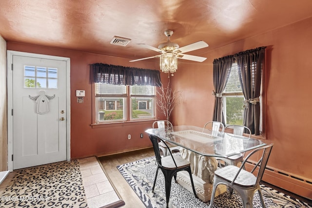 388 Atlantic Ave, Long Branch, NJ 07740 - dining room featuring a ceiling fan, baseboards, and a baseboard radiator