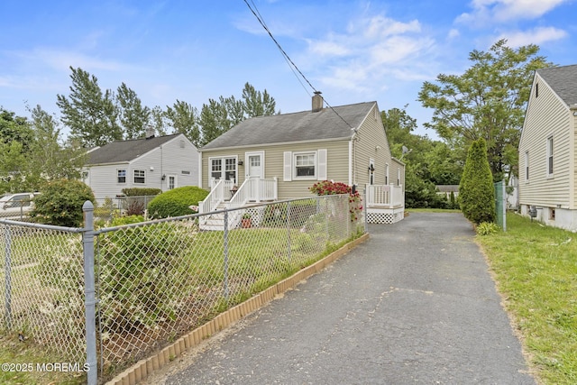 388 Atlantic Ave, Long Branch, NJ 07740 - bungalow-style home with driveway and a chimney