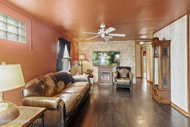 388 Atlantic Ave, Long Branch, NJ 07740 - living room with wood finished floors, a ceiling fan, a glass covered fireplace, and baseboards