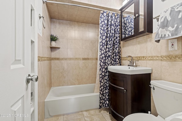 388 Atlantic Ave, Long Branch, NJ 07740 - bathroom featuring shower / bathtub combination with curtain, vanity, toilet, tile patterned floors, and tile walls