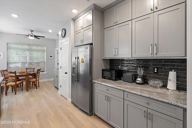 37 Violet Ct, Holmdel, NJ 07733 - kitchen with stainless steel fridge, gray cabinets, backsplash, ceiling fan, and light wood-style floors