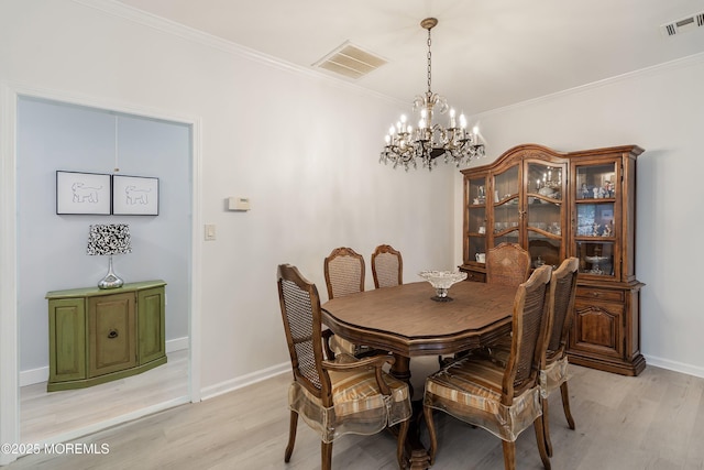 37 Violet Ct, Holmdel, NJ 07733 - dining room featuring light wood finished floors, a chandelier, ornamental molding, and baseboards