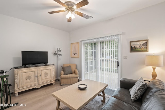 37 Violet Ct, Holmdel, NJ 07733 - living room with ceiling fan and light wood-style flooring
