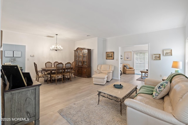 37 Violet Ct, Holmdel, NJ 07733 - living room featuring a chandelier, light wood-style floors, and ornamental molding