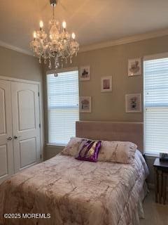 18 Lily Pond Ct, Howell, NJ 07731 - bedroom with a chandelier, ornamental molding, multiple windows, and a closet