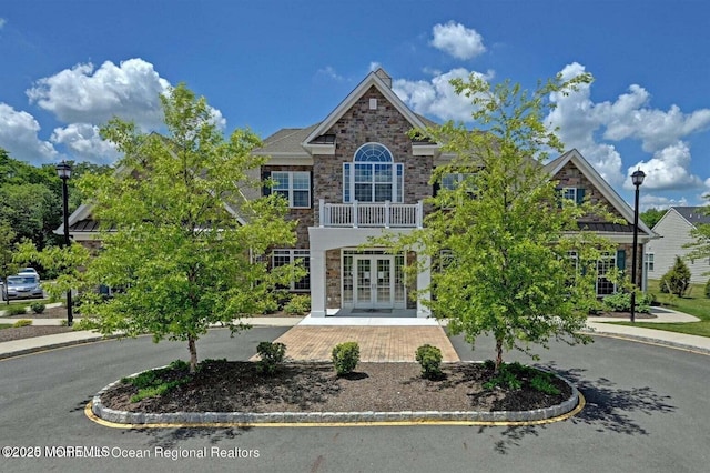 18 Lily Pond Ct, Howell, NJ 07731 - colonial-style house featuring french doors, stone siding, and a chimney