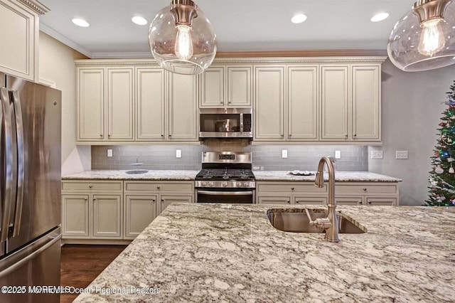 18 Lily Pond Ct, Howell, NJ 07731 - kitchen featuring appliances with stainless steel finishes, a sink, cream cabinets, light stone counters, and recessed lighting