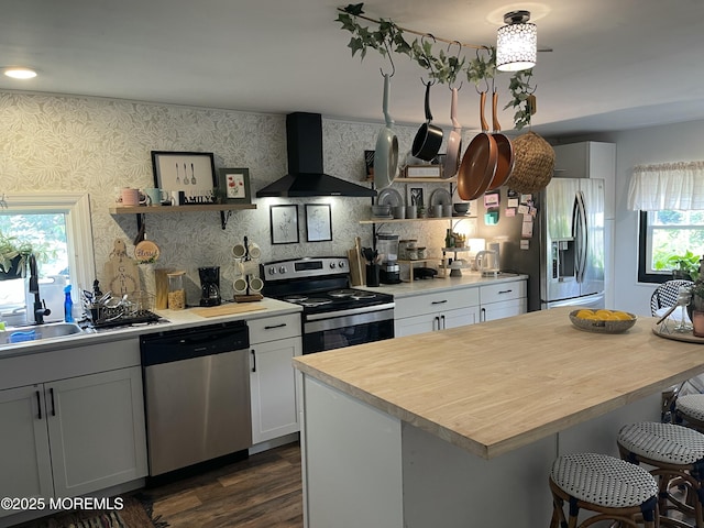45 Cathy Ct, Jackson, NJ 08527 - kitchen with stainless steel appliances, wall chimney range hood, a kitchen breakfast bar, dark wood finished floors, and open shelves