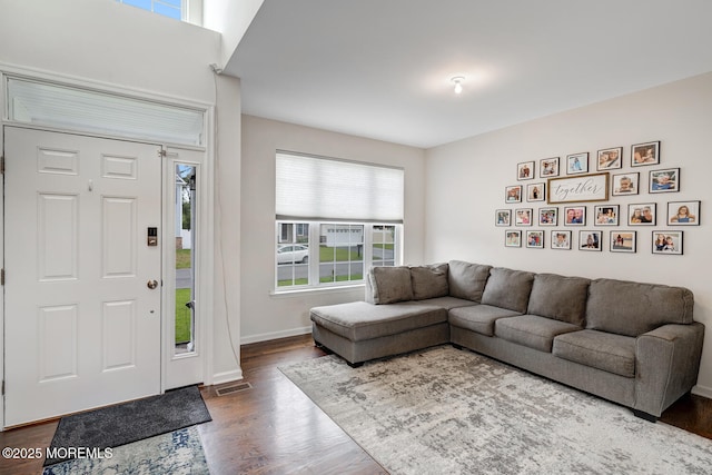 909 Amsterdam Ave, Toms River, NJ 08757 - living room with dark wood-style floors and baseboards