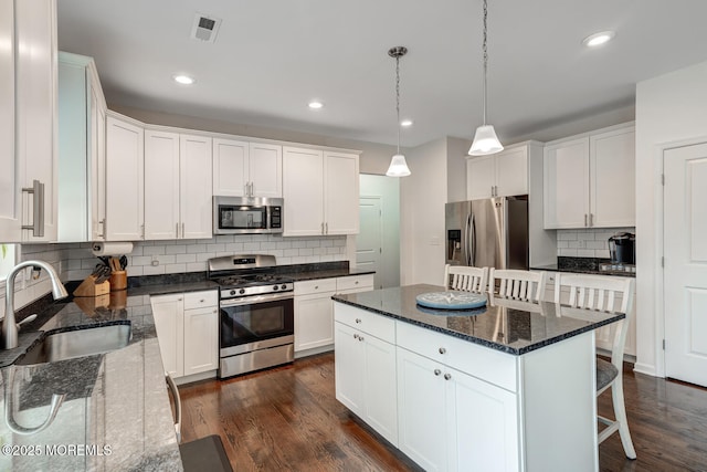 909 Amsterdam Ave, Toms River, NJ 08757 - kitchen featuring stainless steel appliances, a sink, tasteful backsplash, white cabinetry, and recessed lighting