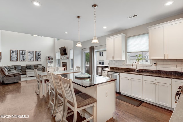 909 Amsterdam Ave, Toms River, NJ 08757 - kitchen featuring dishwasher, a sink, open floor plan, plenty of natural light, and recessed lighting