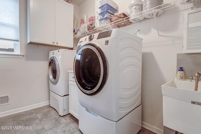 909 Amsterdam Ave, Toms River, NJ 08757 - laundry room with washer and dryer, baseboards, and cabinet space