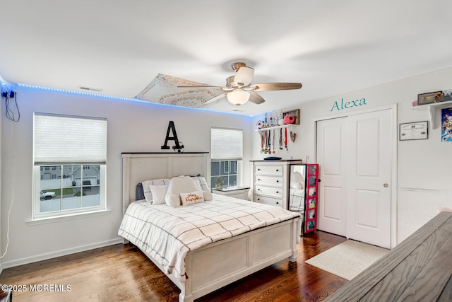909 Amsterdam Ave, Toms River, NJ 08757 - bedroom with dark wood-type flooring, ceiling fan, a closet, and baseboards