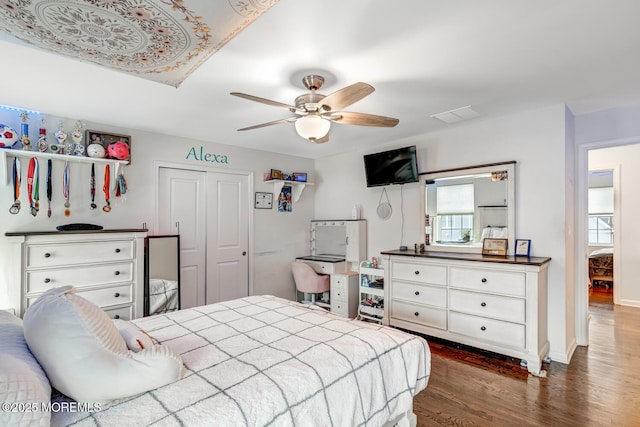 909 Amsterdam Ave, Toms River, NJ 08757 - bedroom with dark wood-style floors, a closet, ceiling fan, and baseboards