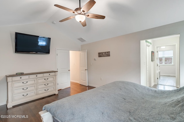 909 Amsterdam Ave, Toms River, NJ 08757 - bedroom with vaulted ceiling, baseboards, ensuite bathroom, dark wood-style floors, and a ceiling fan