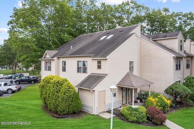 2001 Begonia Ct, Jackson, NJ 08527 - back of house featuring a yard and roof with shingles