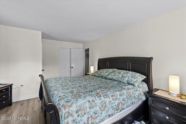 2001 Begonia Ct, Jackson, NJ 08527 - bedroom with wood finished floors, baseboards, and a textured ceiling