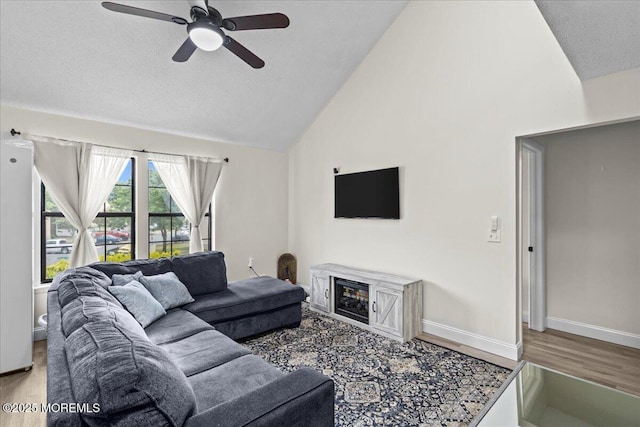 2001 Begonia Ct, Jackson, NJ 08527 - living room featuring ceiling fan, wood finished floors, a textured ceiling, baseboards, and high vaulted ceiling