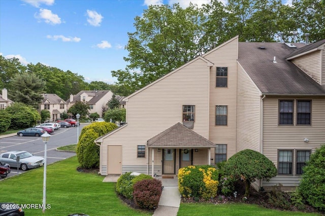 2001 Begonia Ct, Jackson, NJ 08527 - view of front facade with uncovered parking, a front yard, and roof with shingles