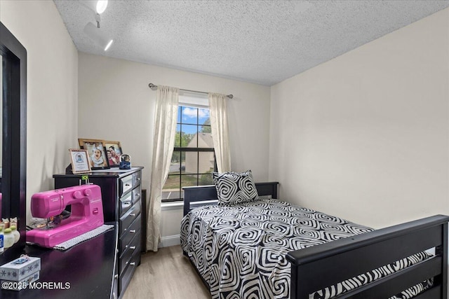 2001 Begonia Ct, Jackson, NJ 08527 - bedroom with light wood finished floors and a textured ceiling