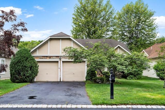 11 Sedgwick Sq, Jackson, NJ 08527 - view of front of house featuring driveway, a front yard, a garage, stucco siding, and a shingled roof