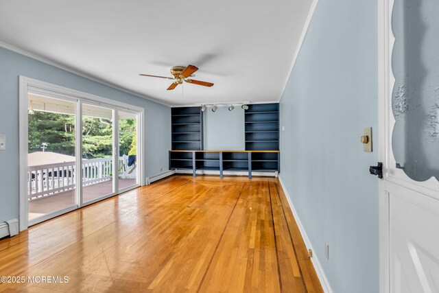 36 Stoney Creek Ln, Colts Neck, NJ 07722 - empty room featuring ceiling fan, light wood-style floors, built in features, baseboards, and ornamental molding