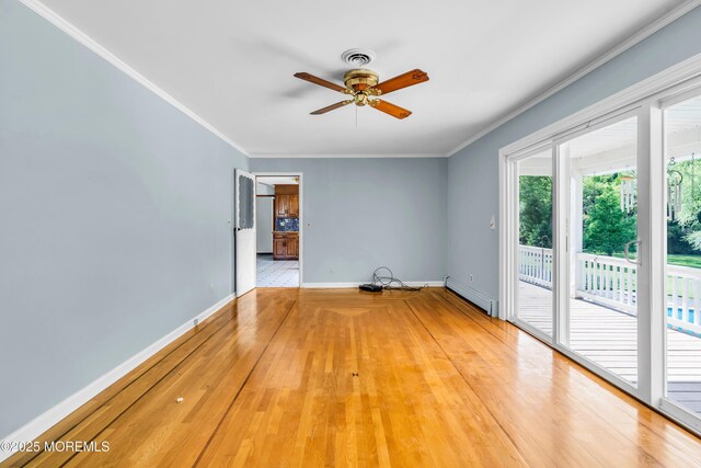 36 Stoney Creek Ln, Colts Neck, NJ 07722 - empty room with baseboard heating, ceiling fan, ornamental molding, baseboards, and wood finished floors