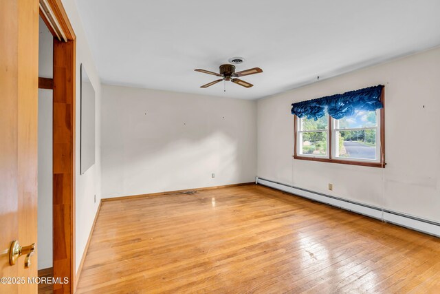 36 Stoney Creek Ln, Colts Neck, NJ 07722 - unfurnished room featuring light wood-style floors, ceiling fan, and a baseboard radiator