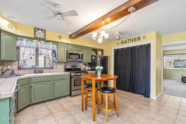 7 Monterey Dr, Hazlet, NJ 07730 - kitchen with appliances with stainless steel finishes, a sink, green cabinetry, backsplash, and a chandelier