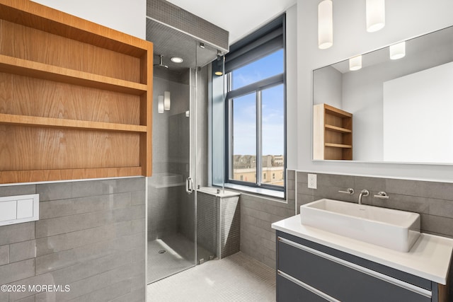601 Bangs Ave Unit 701, Asbury Park, NJ 07712 - full bathroom with tile walls, a shower stall, vanity, and tile patterned floors