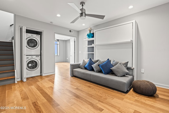 601 Bangs Ave Unit 701, Asbury Park, NJ 07712 - living room with stacked washer / dryer, stairway, a ceiling fan, light wood finished floors, and recessed lighting