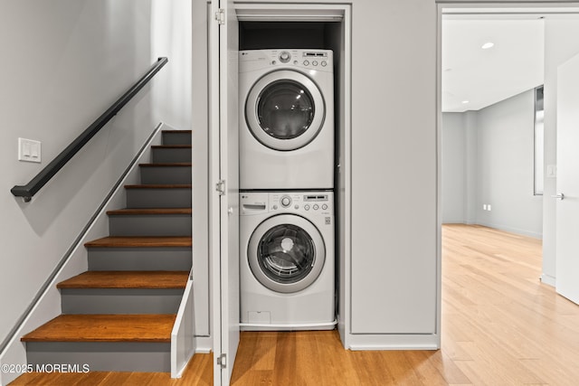 601 Bangs Ave Unit 701, Asbury Park, NJ 07712 - washroom featuring stacked washer and clothes dryer, wood finished floors, baseboards, and recessed lighting