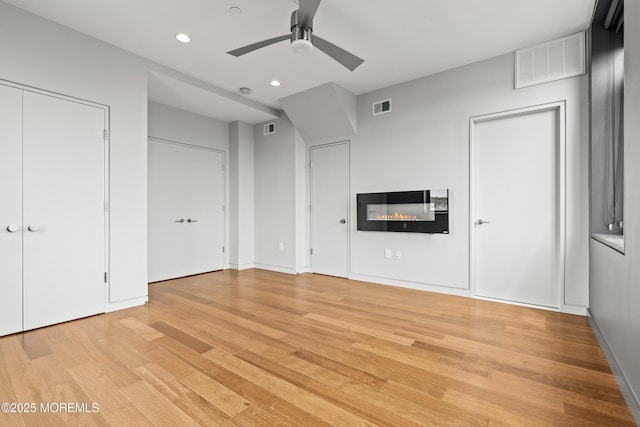 601 Bangs Ave Unit 701, Asbury Park, NJ 07712 - unfurnished bedroom with multiple closets, light wood finished floors, recessed lighting, and a ceiling fan