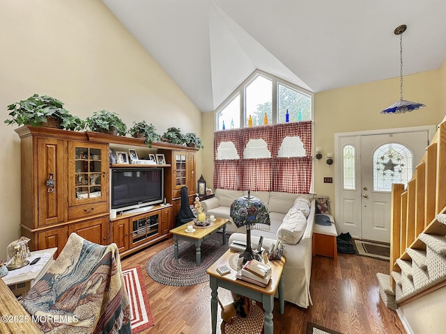 9 Sami Dr, Howell, NJ 07731 - living room featuring high vaulted ceiling, stairway, healthy amount of natural light, and wood finished floors