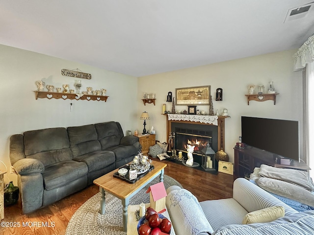 9 Sami Dr, Howell, NJ 07731 - living room with a glass covered fireplace and wood finished floors