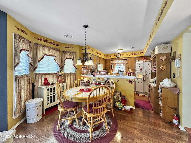 9 Sami Dr, Howell, NJ 07731 - dining room featuring healthy amount of natural light, wood finished floors, and a chandelier